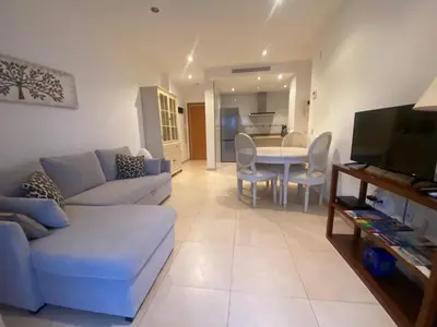a living room with a couch and a table at Apartamento en primera línea de playa 38 in Valencia