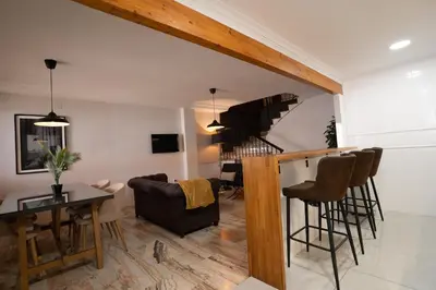 a living room with a table and some chairs at Casa Boutique Playa y Valencia in El Puig