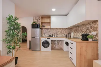a kitchen with a washer and dryer at Casa Estrellita Boutique Apartment in Valencia