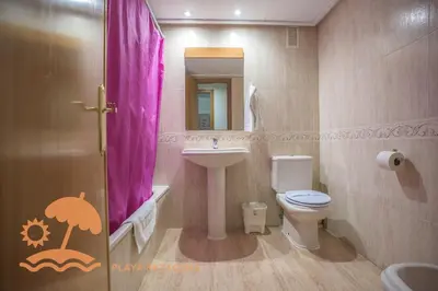 a bathroom with a sink and a toilet and a mirror at Holiday Mare Nostrum in Valencia