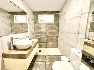 a bathroom with a sink and a toilet at Padre Anton seasonal apartment in Valencia