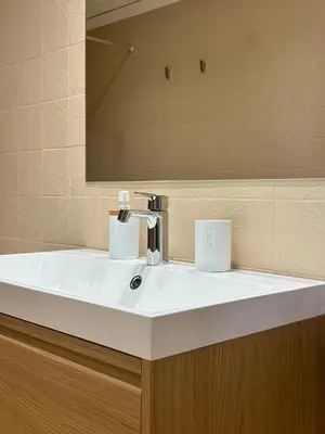 a bathroom with a white sink and a mirror at Cosy Flat Catarroja in Catarroja