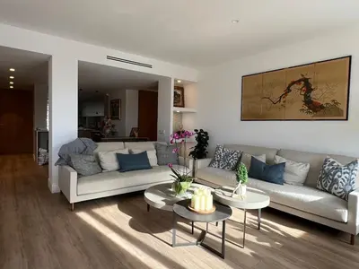 a living room with a couch and a table at Bright spacious luxury apartment in Valencia