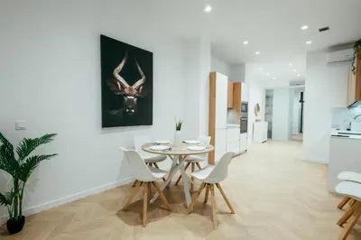 a kitchen and dining room with a table and chairs at Sada Flat, Jacuzzi, Chill Out, 7 Pax, SmartTV in Valencia