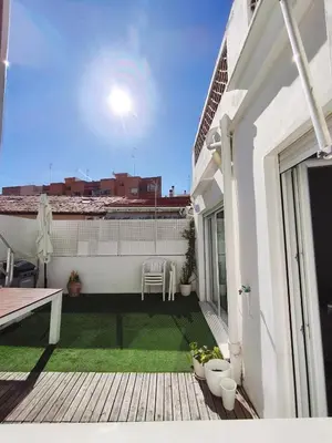 a balcony with a green lawn on a building at Valencia City Premium Terrace Apartment in Valencia
