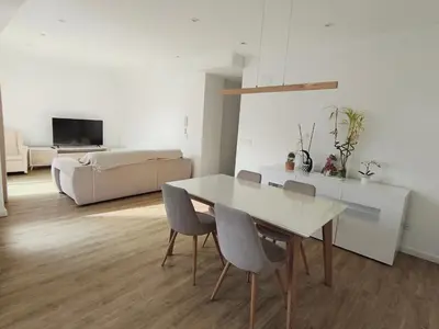 a living room with a white table and chairs at Valencia City Premium Terrace Apartment in Valencia