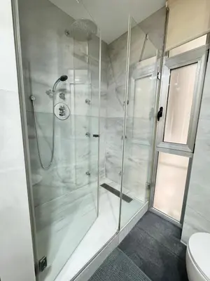 a shower with a glass door in a bathroom at Heart of Valencia in Valencia