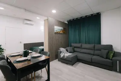 a living room with a couch and a table at N4 Comfortable & bright apartament Park Benicalap in Valencia