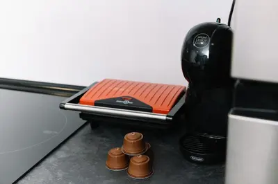 a coffee maker sitting on top of a table at N4 Comfortable & bright apartament Park Benicalap in Valencia