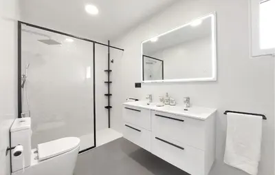 a white bathroom with a sink and a mirror at Awesome Home In Olocau in Olocau