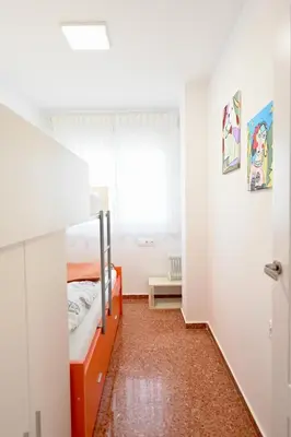 a small room with a bed and a window at Vistas al Mar in Puerto de Sagunto