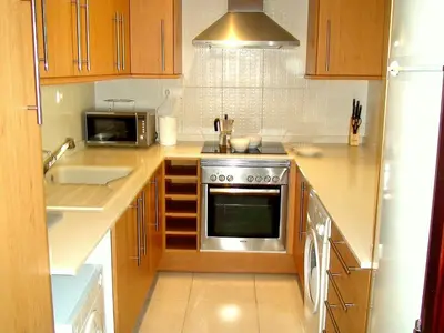 a kitchen with a stove and a microwave at Mestalla Silence in Valencia