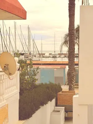 a view of a marina from the balcony of a house at Puerto Beach House in Puebla de Farnals