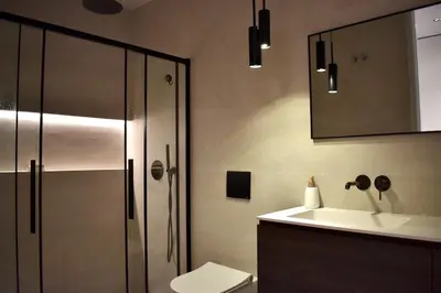 a bathroom with a shower and a toilet and a sink at Stylish & Cozy Flat in heart of Eixample, Valencia in Valencia