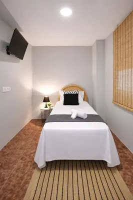 a bedroom with a large bed and a dresser at Central Home Coliving - vive en la zona de moda del centro de Valencia in Valencia