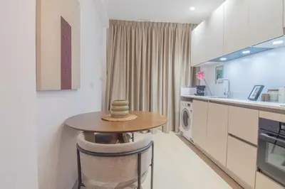 a kitchen with a table with a hat on it at NOMAD Viveros 01 in Valencia
