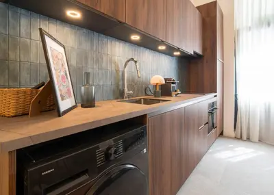 a kitchen with a sink and a washing machine at Studio 01 - Les Artes in Valencia