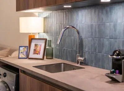 a kitchen counter with a sink and a lamp at Studio 02 - Les Artes in Valencia