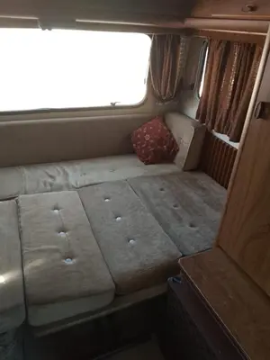 an empty bed in the back of a van at Autocaravana in Port Saplaya