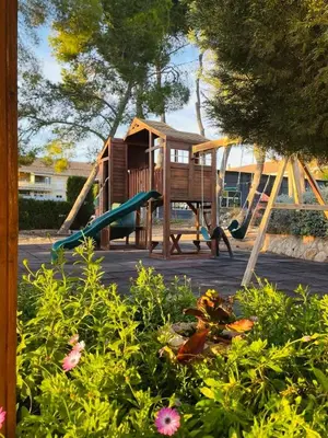 a playground with a slide and a play structure at 2Bedrooms in La Eliana