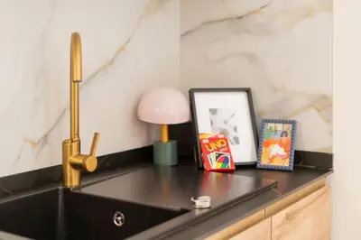 a kitchen counter with a sink and a lamp at República Argentina 02 in Valencia