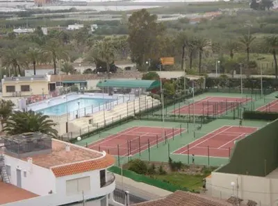 an aerial view of two tennis courts in a city at Triton in Mareny Blau