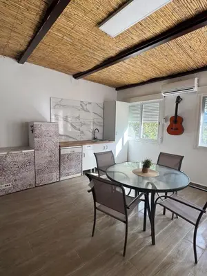 a dining room with a glass table and chairs at Chalet Piscina Privada in Barraca de Aguas Vivas