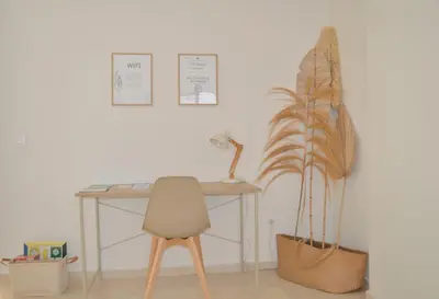 a desk with a chair and a potted plant at Excepcional moderno y luminoso Terraza privada in Valencia