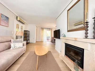 a living room with a couch and a fireplace at Casa Mar in Valencia