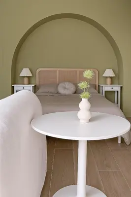 a bedroom with a bed with a white table and two tables at Calma Verde Your getaway in Playa de Valencia in Valencia