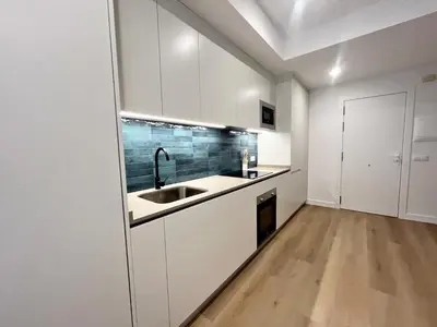 a kitchen with white cabinets and a sink at Loft en el Centro De Valencia Botánico 2 in Valencia