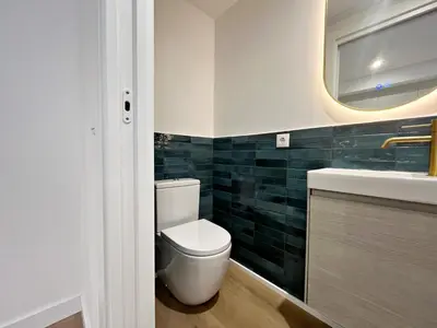 a bathroom with a toilet and a sink and a mirror at Loft en el Centro De Valencia Botánico 2 in Valencia