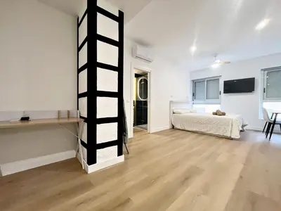 a room with a bed and a ladder in it at Loft en el Centro De Valencia Botánico 2 in Valencia