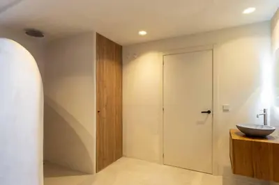 a bathroom with a sink next to a sliding door at VLC Host - Reina 166 B in Valencia