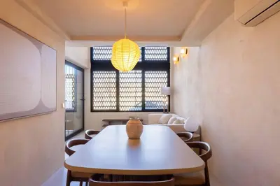 a room with a table and chairs and a window at VLC Host - Reina 166 B in Valencia