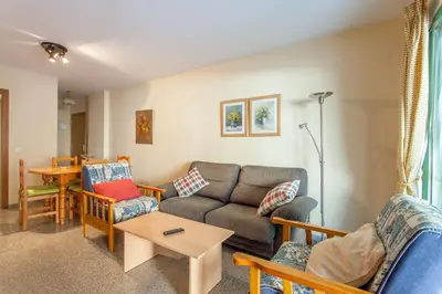 a living room with a couch and chairs and a table at Apartment Patacona Beach 7 in Valencia
