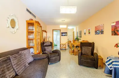 a living room with couches and a dining room at Apartment Patacona Beach 6 in Valencia