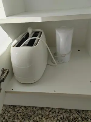 a toaster sitting on a shelf in a kitchen at Maravillosa vistal'mar in Puerto de Sagunto