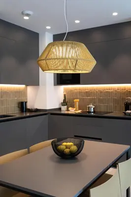 a kitchen with a table with a bowl of fruit on it at Valencia Home Alfahuir in Valencia