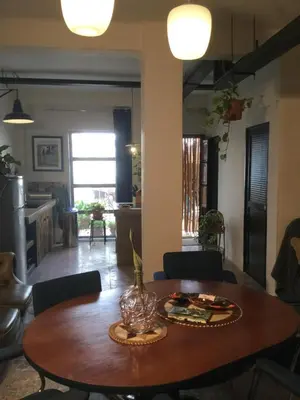 a dining room table with a vase on top of it at Stunning appartment for rent in Valencia in Valencia
