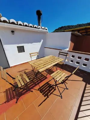 a kitchen with a refrigerator and a tile floor at Casa Trilles in Azuébar