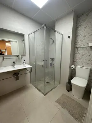 a bathroom with a sink and a mirror at Canoa Studio Valencia in Valencia