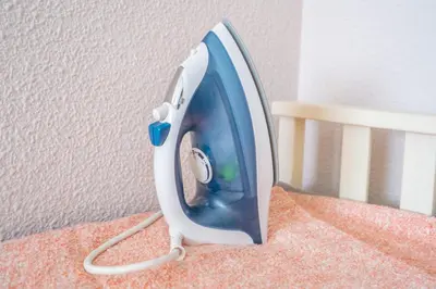 a iron is sitting on top of a table at Apartment Monfort in Valencia