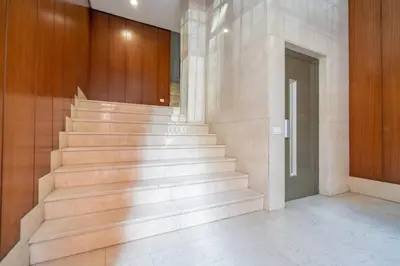 a staircase in a building with wooden walls and a door at Apartment Monfort in Valencia