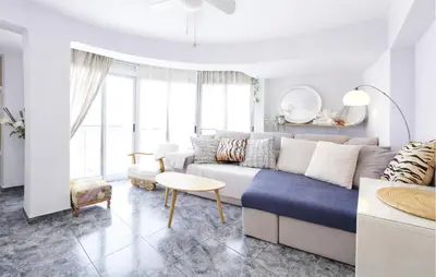 a living room with a couch and a table at Marisol Molina in Sueca