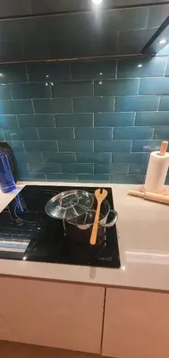 an empty refrigerator with its door open with blue lights at Habitaciones VIP en Vivienda Lujo Muy Céntrica in Valencia