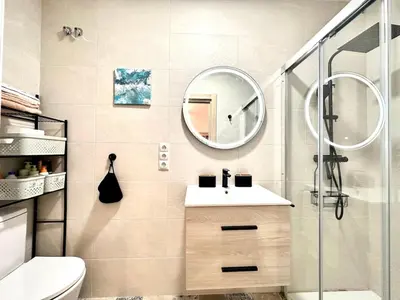 a bathroom with a sink and a mirror at Season apartment Cabañal in Valencia