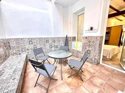 a dining room with a table and chairs at Season apartment Cabañal in Valencia