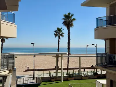 a view of the beach from the balcony of a building at Reinapart Patacona Beach Sunrise in Valencia