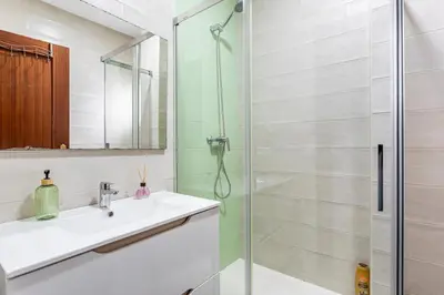a bathroom with a sink and a shower at Guest Ready - Bright flat well‑located urban stay in Valencia